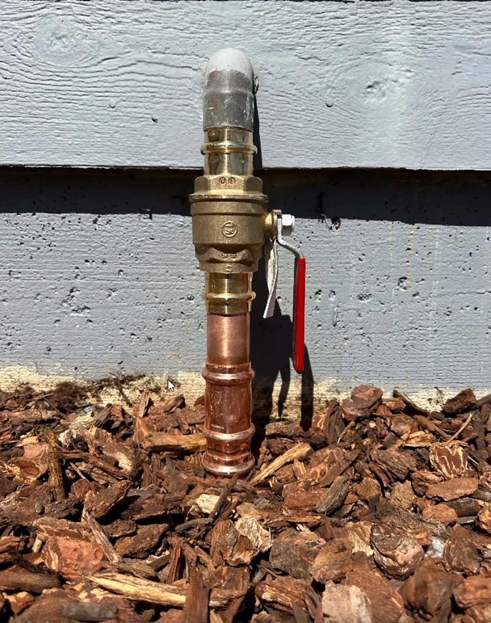 New main water shutoff valve installed with ProPress fittings and upgraded copper piping, providing a durable, leak-resistant residential water line connection.