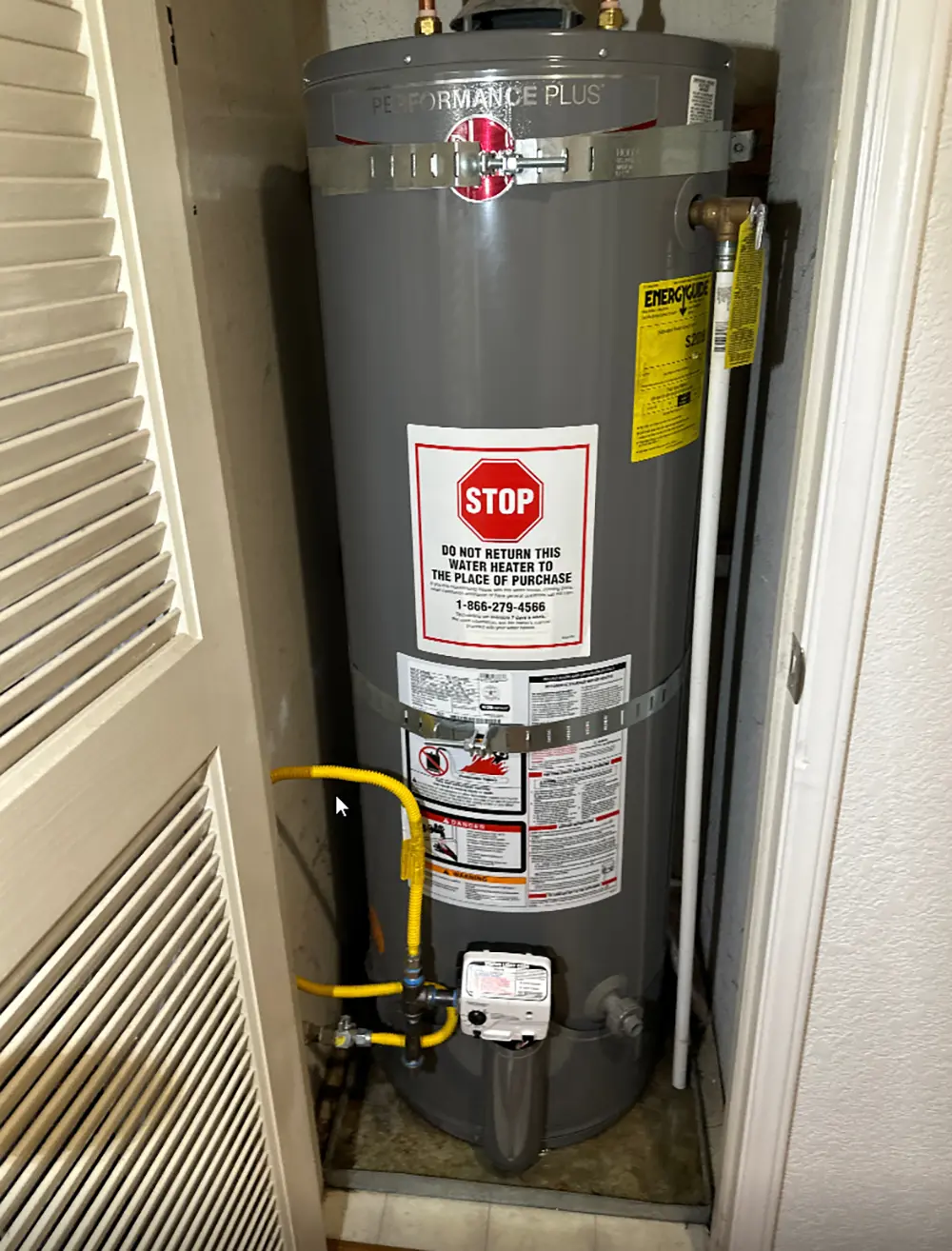 Repaired residential gas water heater with new gas control valve and burner assembly installed, fully tested for safe ignition, reliable heating, and proper operation.