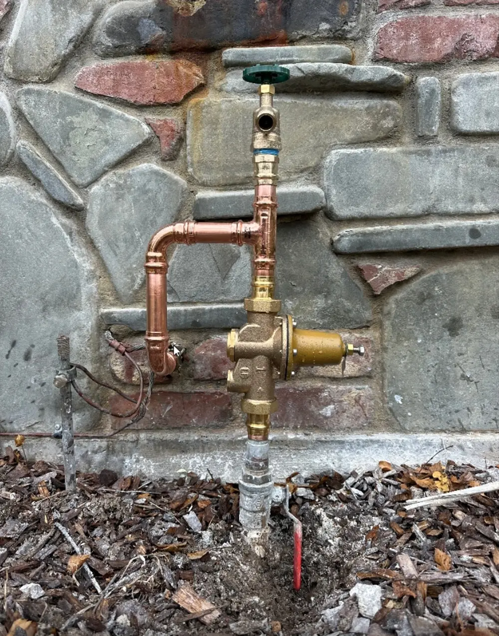 New pressure reducing valve (PRV) installed with ProPress copper piping and main shutoff valve connection to regulate residential water pressure and protect plumbing fixtures.
