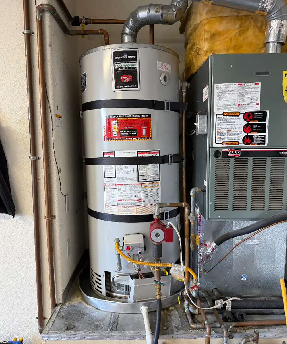 Professional 75-gallon water heater replacement featuring Type L copper pipe upgrades, ProPress connections, recirculation line replacement, and leak-free plumbing installation in a residential home